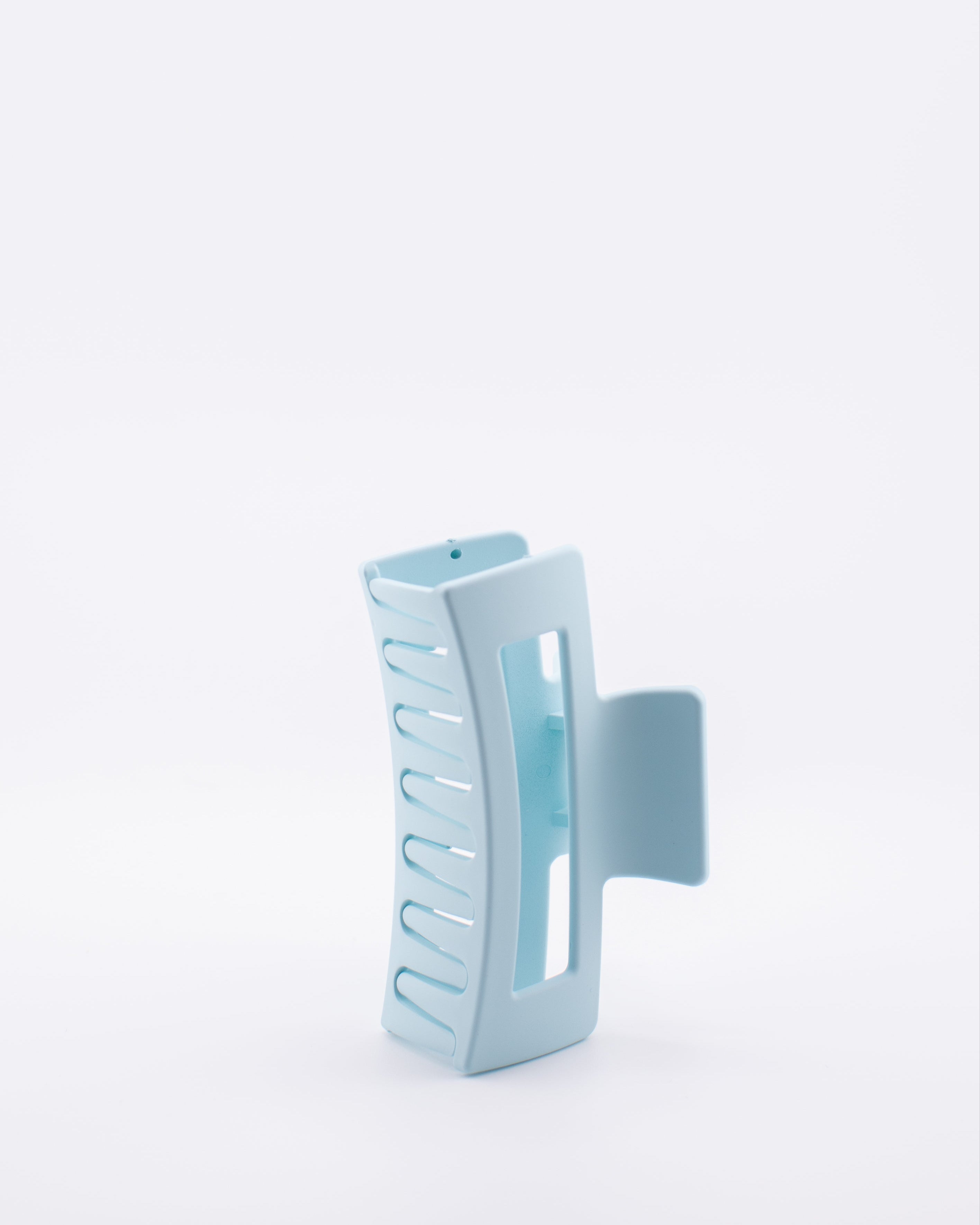 Light blue hair clip on a white background