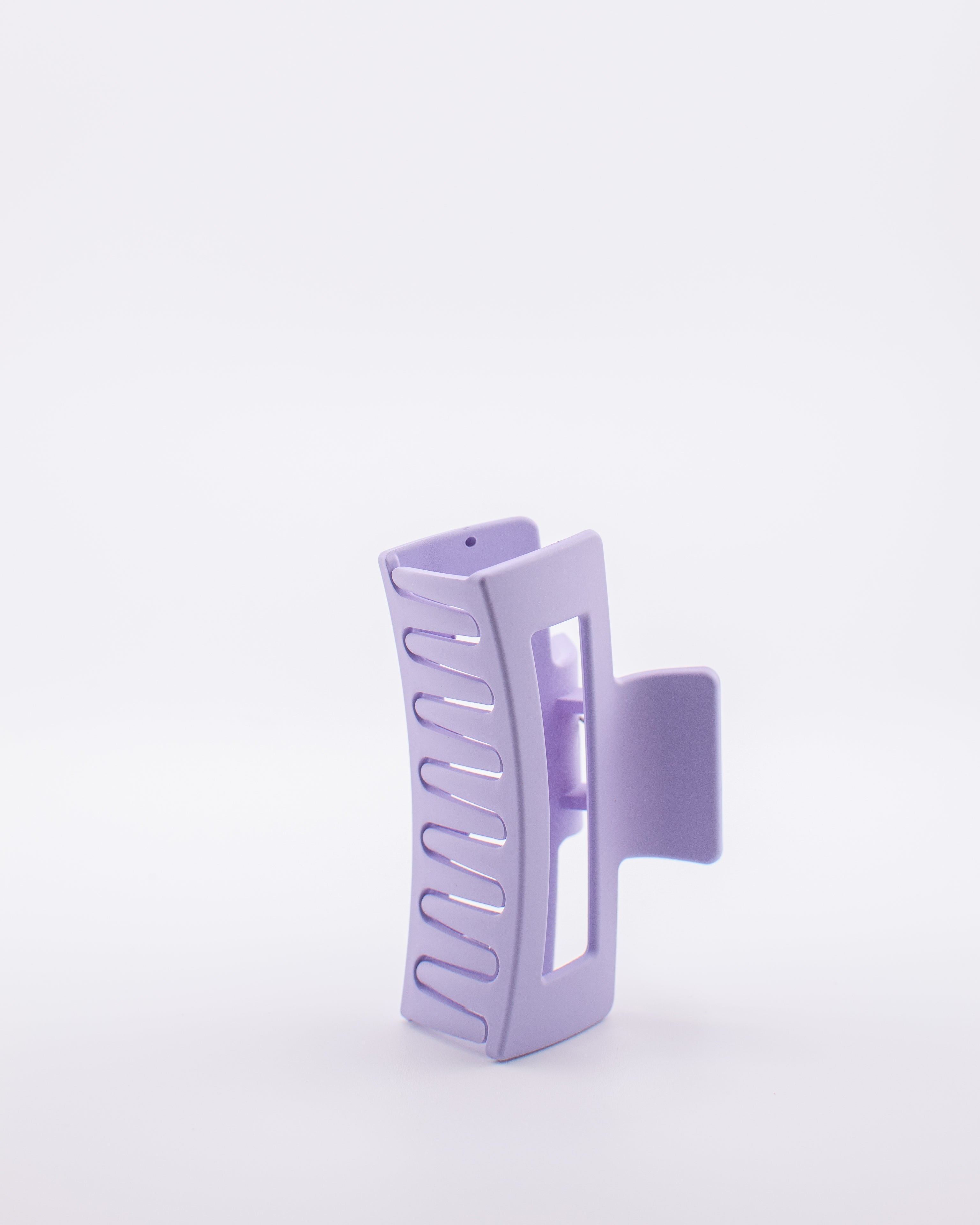 Purple hair clip on a white background