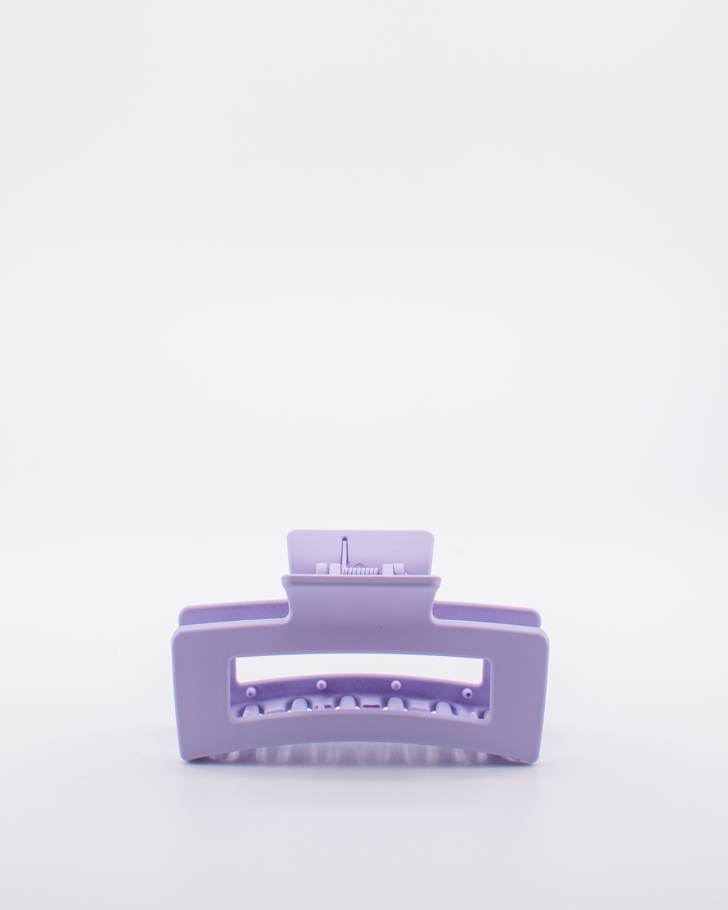 Purple hair clip on a white background