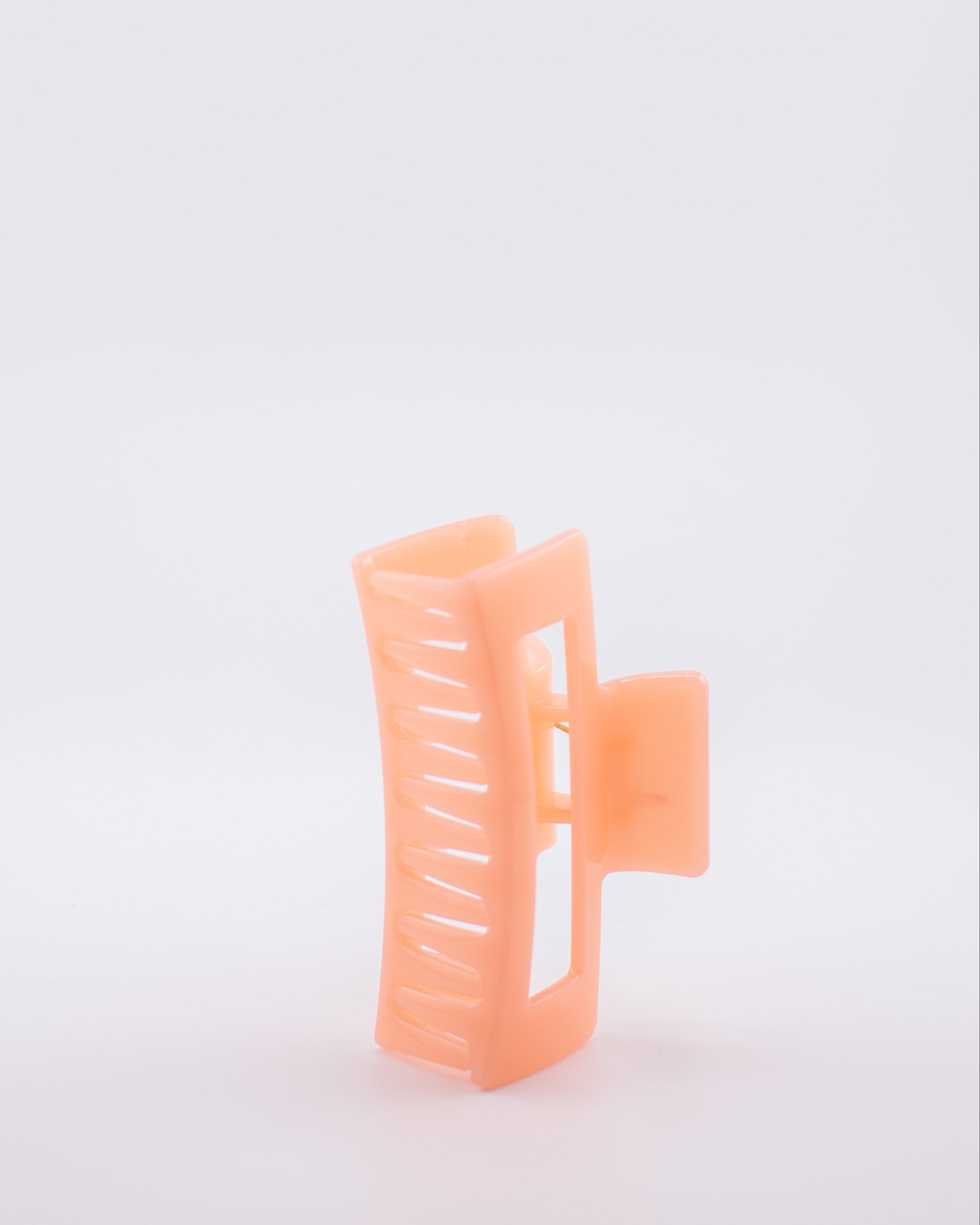 Orange hair clip on a 