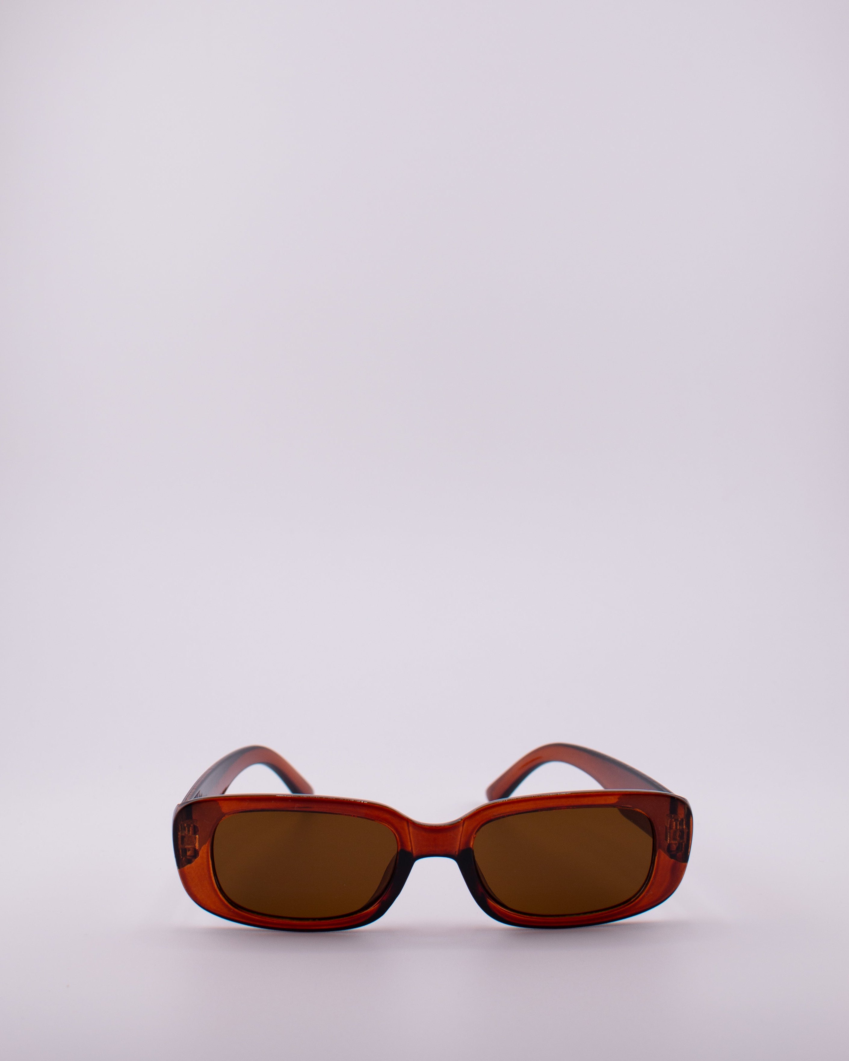 Brown sunglasses on a white background